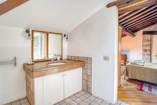 a bathroom with a sink and a mirror at Castello di Magrano in Gubbio
