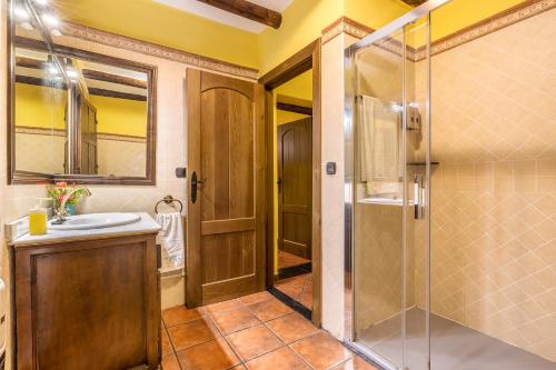a bathroom with a shower and a sink at Cortijo Jiménez in Pitres