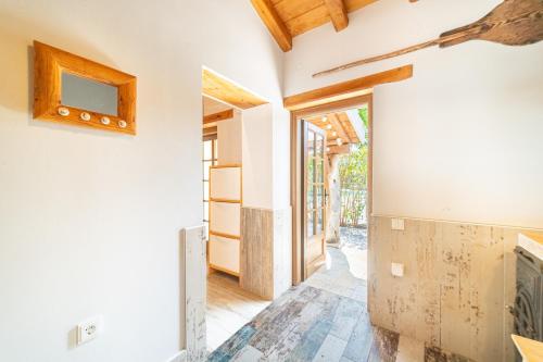 a hallway with a fireplace in a house at Mini Country House in Sidari