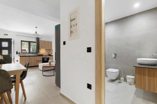 a bathroom with a sink and a toilet in a room at Sokol stone house in Vlikhón