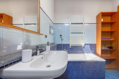 a bathroom with a sink and a mirror at La Mansarda del Viaggiatore in Pont-Saint-Martin