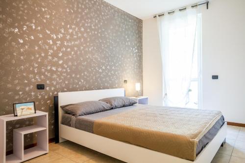 a bedroom with a bed and a wall with stars at Belvedere in Scarlino