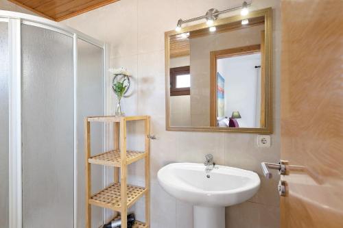 a bathroom with a sink and a mirror at Villa Jeamir I in Playa Blanca
