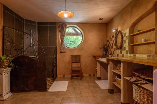 a bathroom with a shower and a sink at Gîte Écologique - Le Nid des Anges in Saint-André-Lachamp