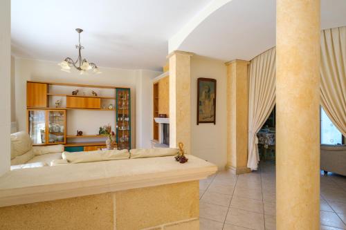 a living room with a couch and a table at Casa Angel in Galatone