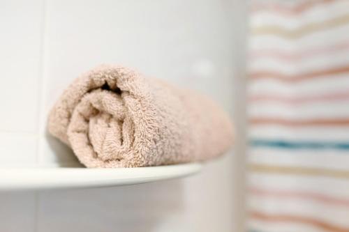 a towel is sitting on a shelf in a bathroom at Piso tazacorte in Tazacorte