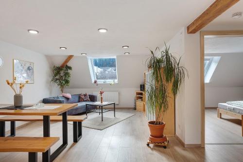 a living room with a couch and a table at Haus an der Breg in Vöhrenbach