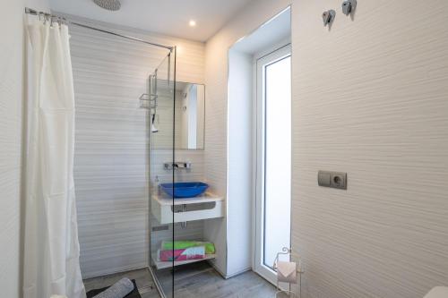 a bathroom with a shower and a glass shower stall at San Jose in Nerja