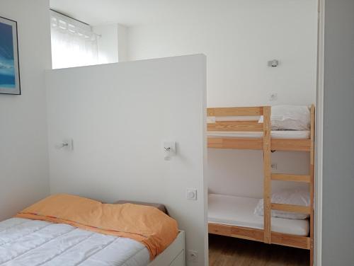 a bedroom with a bed and a bunk bed at T2 bis Vue Aneto in Luchon