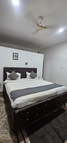 a bedroom with a large bed in a room at Hotel blue ocean baga beach away in Arpora