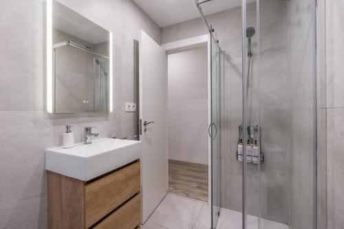 a bathroom with a sink and a shower at Bright Apartment In Maracena in Granada