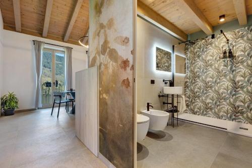 a bathroom with a shower and a toilet in it at Casa Meg in Tremosine Sul Garda