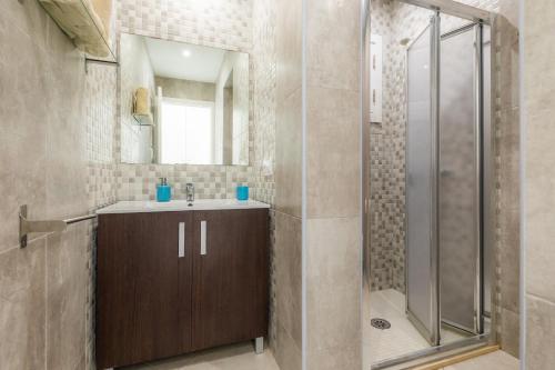 a bathroom with a shower and a sink at Ca Na Bergues in Ariany