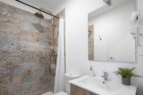 a bathroom with a sink and a shower at Casa Cándido in Ribarteme