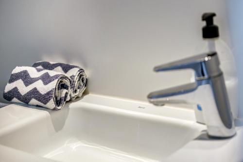 a towel sitting on a sink next to a faucet at Casa Miramar in Sa Ràpita