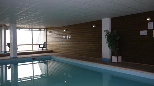 a swimming pool in a building with at VVF "Piau-Engaly" Aragnouet in Aragnouet