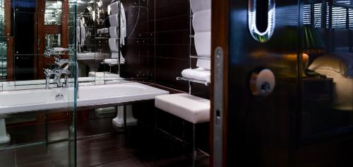 a bathroom with a sink and a mirror at Boundary Shoreditch in London