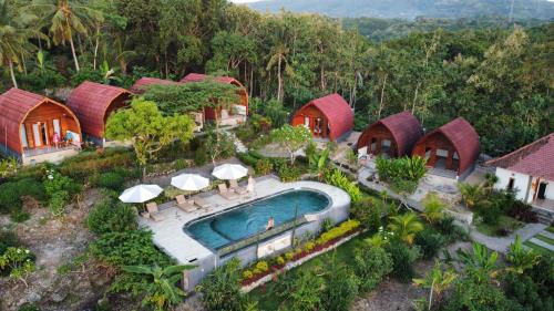 an aerial view of a resort with a swimming pool at Kubuhill Sunset Bungalow in Nusa Penida