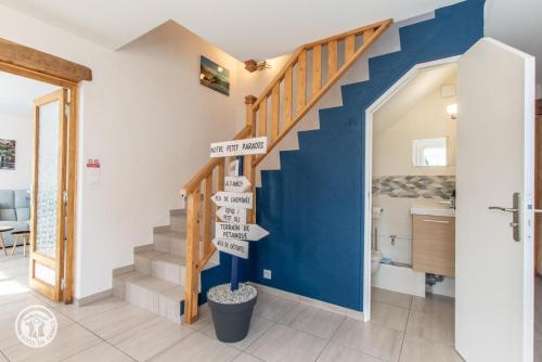 a staircase in a house with signs on it at Notre Petit Paradis in Annecy