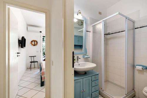 a bathroom with a sink and a shower at Casa Ghibli in Loano