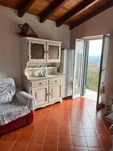 a bathroom with a sink in a room with an open door at Maltina country house in Savona