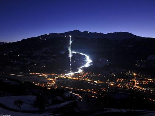 a city lit up at night on a mountain at Gästehaus Loithaler in Fügen