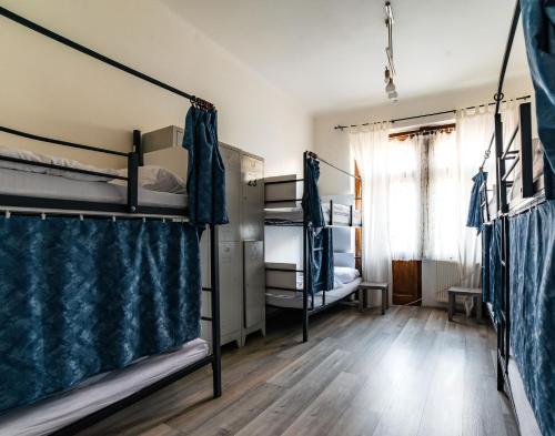 a room with two bunk beds and a window at Hostel Jasmin in Prague