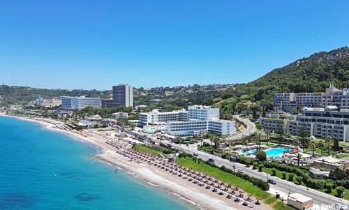 an aerial view of a beach with buildings and the ocean at Sinani Apartment - Sea View Balcony & Jacuzzi Gem in Asgourou