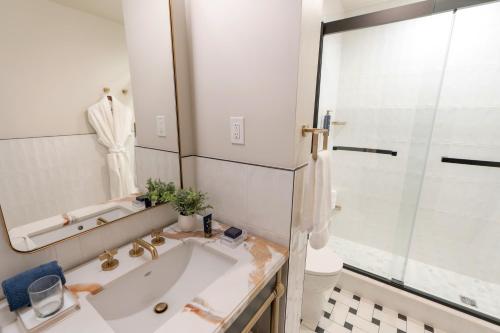 a bathroom with a sink and a shower at The Hoya Hotel at Georgetown in Washington, D.C.