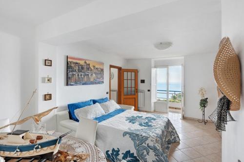 a bedroom with a bed and a table in it at Le Terrazze Di Serafina in Furore