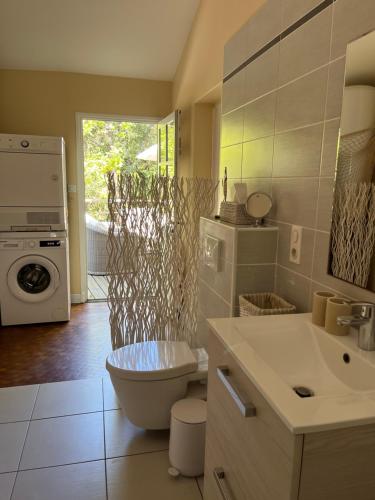 a bathroom with a sink and a toilet in it at Maison Albatros in Pyla-sur-Mer