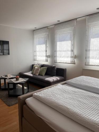 a living room with two beds and a couch at Weingut Zenz-Pohl in Kinheim