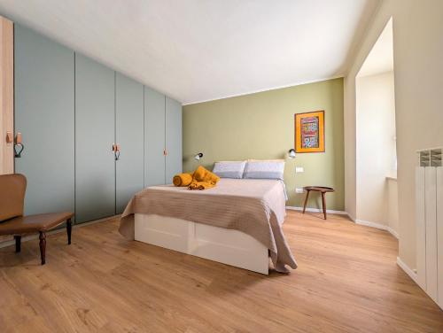 a bedroom with a bed with a teddy bear on it at Borgo Mare in Piombino