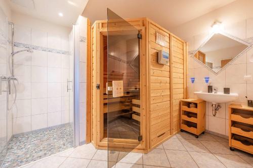 a bathroom with a shower and a sink at Ferienwohnung Krebs in Loddin