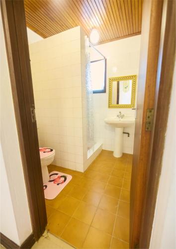 a bathroom with a toilet and a sink at Cutie Studio Unit Nyali in Mombasa