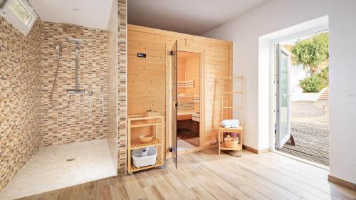 a bathroom with a shower and a toilet in it at Boutique Hideaway Cortijo El Sarmiento - Adults Only in Mojácar