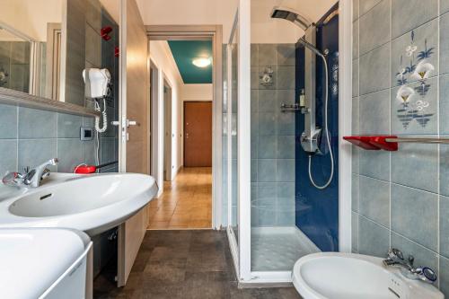 a bathroom with a sink and a shower at Casa Tuly 1 in Brenzone sul Garda