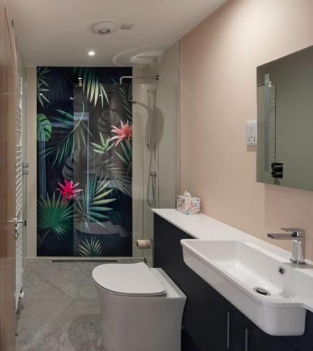 a bathroom with a toilet and a sink at Sunny Ridge in Fort Augustus
