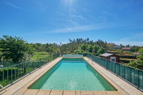 a swimming pool on top of a balcony at Casa Agostinho - with private pool near Coimbra in Graça