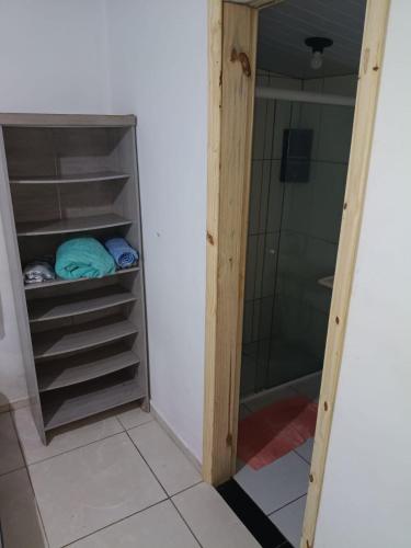 a bathroom with a shower and a walk in closet at Casa 70 Hostel 350m da praia Balneario Flamingo in Matinhos