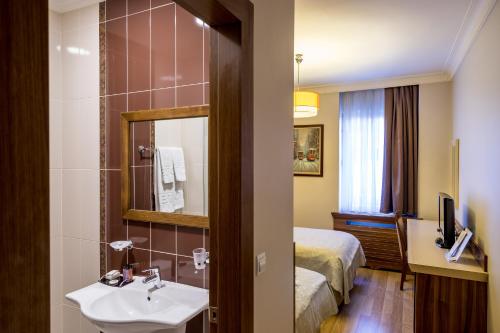 Postel nebo postele na pokoji v ubytování My Rose Hotel