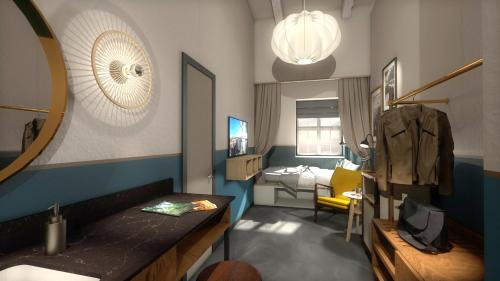 a room with a bedroom with a bed and a mirror at HENRI Hotel Cuxhaven in Cuxhaven