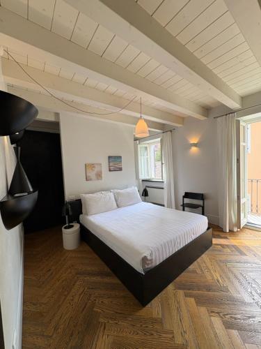 a bedroom with a large bed in a room at Il Cantun in Monforte dʼAlba