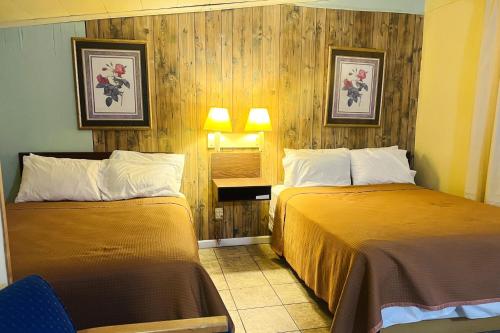 a hotel room with two beds in a room at Sparta Motel Near St Louis- Mississippi River IL in Sparta