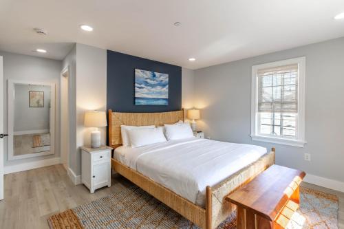 a bedroom with a large bed and a table at The Newport Lofts - 617 Thames Street in Newport