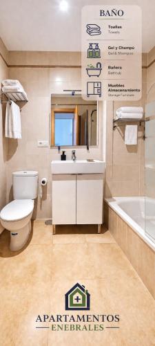 a bathroom with a toilet and a sink and a tub at Enebrales 304 in Punta Umbría