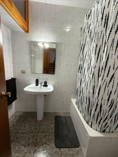 a bathroom with a sink and a bath tub at Fina beach in Nules