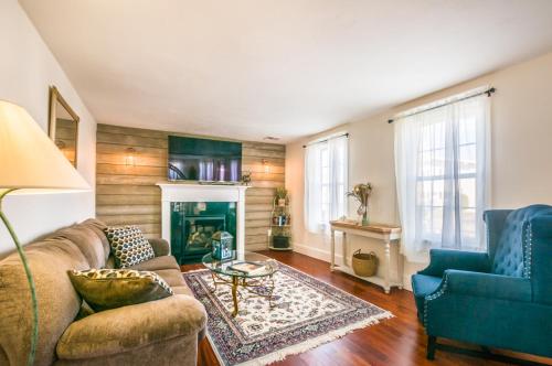 a living room with a couch and a fireplace at Cape Cod Home—Deck, Near Canal Bike Path in Sandwich