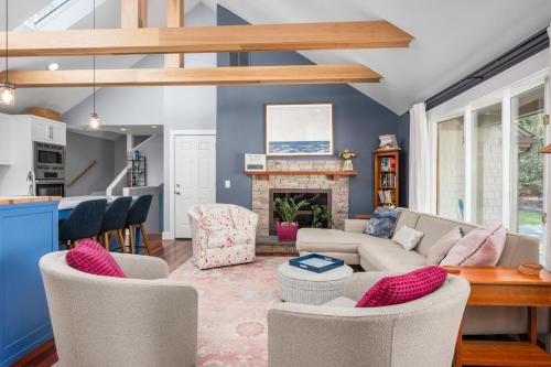 a living room with a couch and a fireplace at Gorgeous Cape Cod Retreat Near Town Neck in East Sandwich