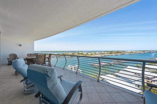 a balcony with chairs and a view of the ocean at Bella Luna 908 in Orange Beach